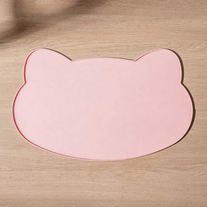 Pink cat-shaped silicone feeding mat with a raised border